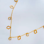 Aura | Collar mano de Fátima piedras transparentes dorado